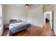 Bedroom featuring hardwood floors, neutral walls, and a ceiling fan at 14615 Bridle Trace Ln, Pineville, NC 28134