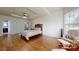 Large primary bedroom featuring hardwood flooring and plenty of natural light at 14615 Bridle Trace Ln, Pineville, NC 28134