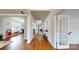Welcoming foyer with hardwood floors leads into the house, highlighting the open floor plan and natural light at 14615 Bridle Trace Ln, Pineville, NC 28134