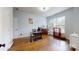 Bright office space featuring a modern desk, hardwood flooring, and ample natural light at 14615 Bridle Trace Ln, Pineville, NC 28134