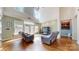 Spacious living room with high ceilings, natural light, and hardwood flooring at 14615 Bridle Trace Ln, Pineville, NC 28134