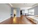 Spacious primary bedroom with hardwood floors and ensuite bathroom entrance at 14615 Bridle Trace Ln, Pineville, NC 28134