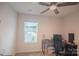 Bedroom with natural light, fan, and space for a study area at 14806 Tamarack Dr, Charlotte, NC 28278