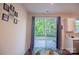 Bright dining area with sliding glass doors leading to the backyard patio at 14806 Tamarack Dr, Charlotte, NC 28278