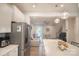 Modern kitchen featuring white cabinets, stainless steel appliances, and open layout at 14806 Tamarack Dr, Charlotte, NC 28278