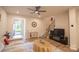 Cozy living room with wood floors, staircase, and neutral decor at 14806 Tamarack Dr, Charlotte, NC 28278