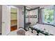 Elegant bathroom with walk-in shower, tiled accents, and a view to the outside at 150 8Th Ave, New London, NC 28127