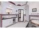 Stylish bathroom offers black and white tile and well-lit vanity space at 150 8Th Ave, New London, NC 28127