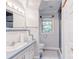 Bathroom featuring decorative tile, white vanity, and a walk-in shower at 150 8Th Ave, New London, NC 28127