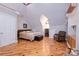 Cozy bedroom with a sloped ceiling, hardwood floors, and a comfortable bed, offering a peaceful retreat at 150 8Th Ave, New London, NC 28127
