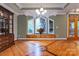 Dining room featuring hardwood floors, large windows, and decorative molding at 150 8Th Ave, New London, NC 28127