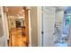Hallway leading to a dining room and a powder room with decorative trim at 150 8Th Ave, New London, NC 28127