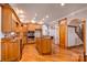 Spacious kitchen features wood cabinetry, an island, and hardwood flooring at 150 8Th Ave, New London, NC 28127
