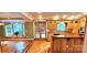 Eat-in kitchen featuring wooden cabinets, island, and a large bay window offering natural light at 150 8Th Ave, New London, NC 28127