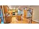 Spacious kitchen features wood cabinetry, an island, and unique hardwood flooring at 150 8Th Ave, New London, NC 28127