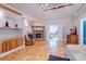 Large main bedroom features a fireplace, built-in shelving, a bathroom, and hardwood floors at 150 8Th Ave, New London, NC 28127