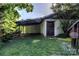 A functional outbuilding with a covered area, offering extra storage and utility space on the property at 150 8Th Ave, New London, NC 28127