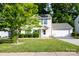 Charming two-story home with a two car garage, solar panels, and a well-manicured front lawn at 1518 Glenbar Ct, Clover, SC 29710