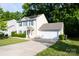 Charming two-story home with a two car garage, solar panels, and a well-manicured front lawn at 1518 Glenbar Ct, Clover, SC 29710