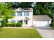 Charming two-story home with a two car garage, solar panels, and a well-manicured front lawn at 1518 Glenbar Ct, Clover, SC 29710