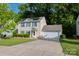 Charming two-story home with a two car garage, solar panels, and a well-manicured front lawn at 1518 Glenbar Ct, Clover, SC 29710