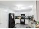 Kitchen with white cabinetry, modern appliances, and granite countertops at 1518 Glenbar Ct, Clover, SC 29710