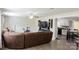 Open concept living room with hardwood floors, ceiling fan, kitchen, and mounted TV at 1518 Glenbar Ct, Clover, SC 29710