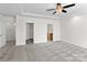 Bright bedroom features a ceiling fan and entrances to a walk-in closet and bathroom at 1530 S Church St # K, Charlotte, NC 28203