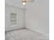 Bright bedroom featuring neutral walls, plush carpet, and a window letting in natural light at 1530 S Church St # K, Charlotte, NC 28203