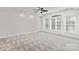 Sun-filled bedroom featuring neutral carpet and large windows at 1530 S Church St # K, Charlotte, NC 28203
