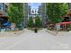 Modern courtyard with walkways, outdoor seating, and landscaped areas between buildings at 1530 S Church St # K, Charlotte, NC 28203