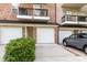 Charming townhouse with brick facade, attached garage, and balconies overlooking the community at 1530 S Church St # K, Charlotte, NC 28203