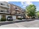 Multi-unit exterior with parking, garages, landscaping, and private balconies at 1530 S Church St # K, Charlotte, NC 28203