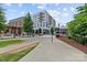 Modern apartment building with restaurant and commercial space, and inviting sidewalks and green spaces at 1530 S Church St # K, Charlotte, NC 28203