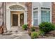 Welcoming brick home with double doors, decorative wreath, and manicured landscaping at 1530 S Church St # K, Charlotte, NC 28203