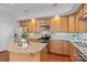 Bright kitchen features granite countertops, stainless appliances, and wooden cabinets at 1530 S Church St # K, Charlotte, NC 28203