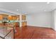 Open living space featuring hardwood floors, island kitchen, and stainless steel appliances at 1530 S Church St # K, Charlotte, NC 28203