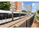 Trolley speeding past condos and office buildings at 1530 S Church St # K, Charlotte, NC 28203