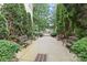 Landscaped walkway with park benches leading to gated entrance at 1530 S Church St # K, Charlotte, NC 28203
