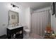 Modern bathroom featuring a black vanity and decorative shower curtain at 1575 Lewis Farm Rd, Kings Mountain, NC 28086