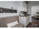 Convenient butler's pantry with custom cabinets, granite counter, and decorative Farmhouse sign at 1575 Lewis Farm Rd, Kings Mountain, NC 28086