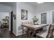 Charming dining area features wood table, cushioned chairs, and a view into the living area for easy entertaining at 1575 Lewis Farm Rd, Kings Mountain, NC 28086