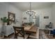 Bright dining room with a wooden table, upholstered chairs, buffet, and a decorative wreath at 1575 Lewis Farm Rd, Kings Mountain, NC 28086