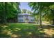 Charming two-story home with gray siding, black shutters, and a welcoming front porch at 1575 Lewis Farm Rd, Kings Mountain, NC 28086