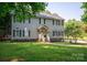 Charming two-story home with gray siding, black shutters, and a welcoming front porch at 1575 Lewis Farm Rd, Kings Mountain, NC 28086