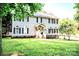 Charming two-story home with grey siding, black shutters, and a well-manicured lawn at 1575 Lewis Farm Rd, Kings Mountain, NC 28086