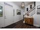 Inviting foyer with a staircase and wood flooring, creating a warm and welcoming entrance at 1575 Lewis Farm Rd, Kings Mountain, NC 28086