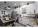 Modern kitchen featuring stainless steel appliances, granite countertops, and white cabinets at 1575 Lewis Farm Rd, Kings Mountain, NC 28086