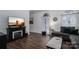 Elegant living room with a modern fireplace, dark wood floors, and a comfortable seating area at 1575 Lewis Farm Rd, Kings Mountain, NC 28086