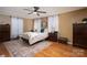 Comfortable main bedroom with wood floors, natural light, and neutral decor, creating a relaxing retreat at 1575 Lewis Farm Rd, Kings Mountain, NC 28086